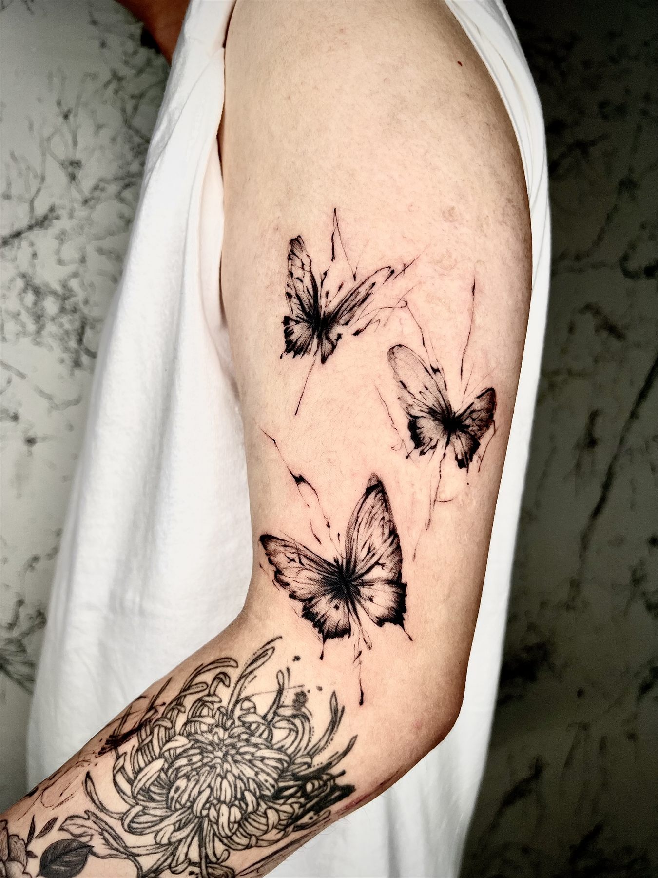 Small Tattoo in Seoul example: Butterfly trio linework by YOONSEUL